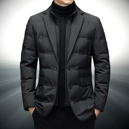 Black puffer jacket worn by a person on a gray background
