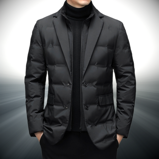 Black puffer jacket worn by a person on a gray background