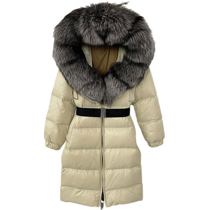Beige puffer coat with a large fur hood on a white background