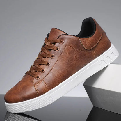 Brown leather sneaker with white sole on a reflective surface