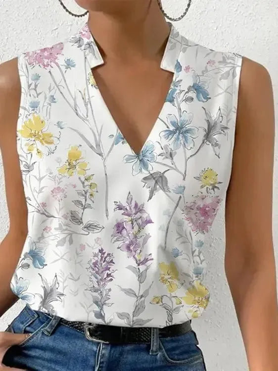 Floral sleeveless top worn by a person on a plain background