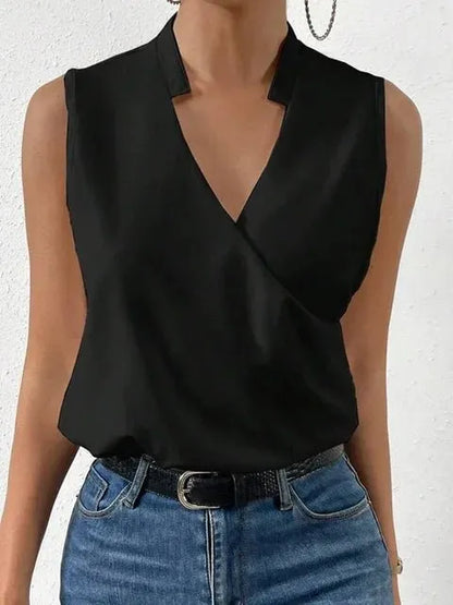 Black sleeveless top worn by a person with a white background