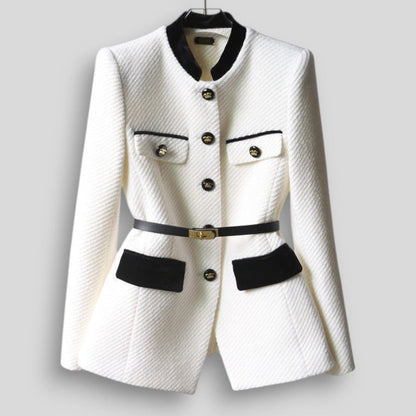 White blazer with black accents on a gray background