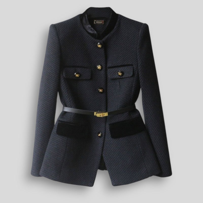 Navy blazer with gold buttons on a light gray background