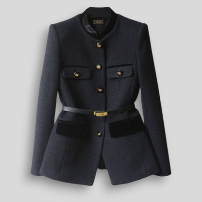 Navy blazer with gold buttons on a light gray background