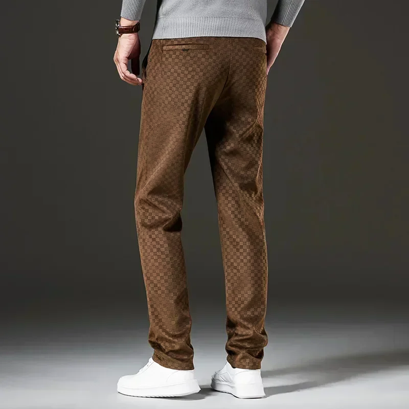 Brown patterned pants worn by a person on a dark background