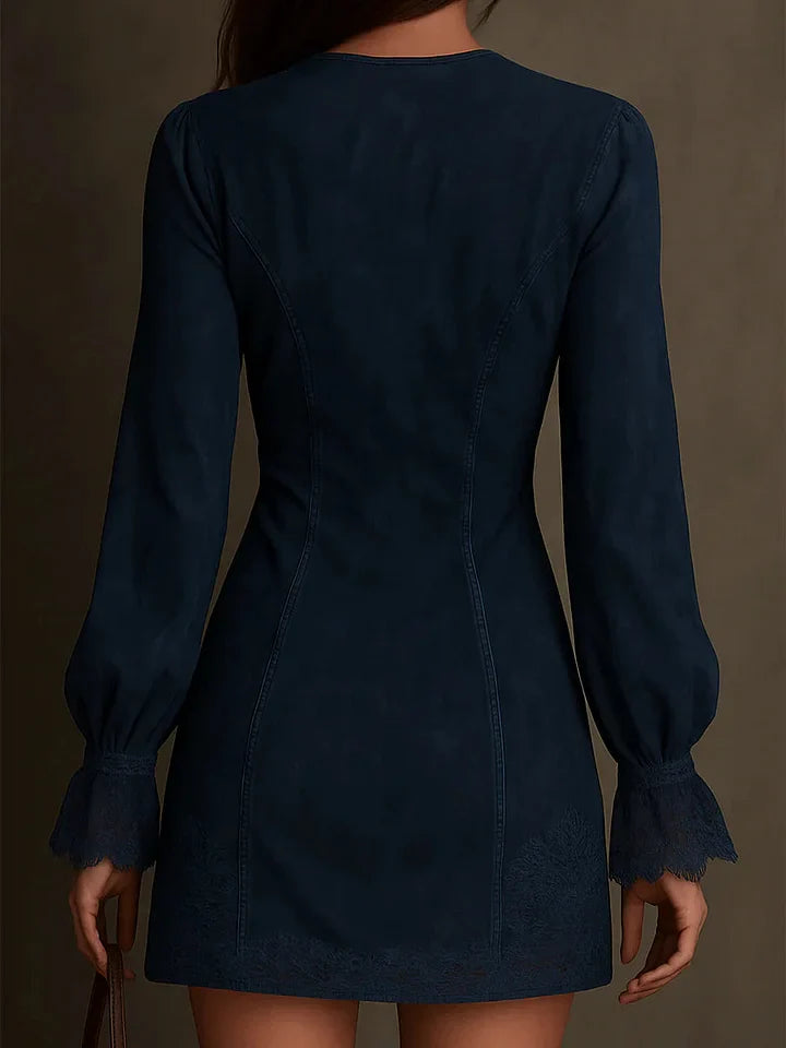 Navy blue dress with long sleeves on a plain background