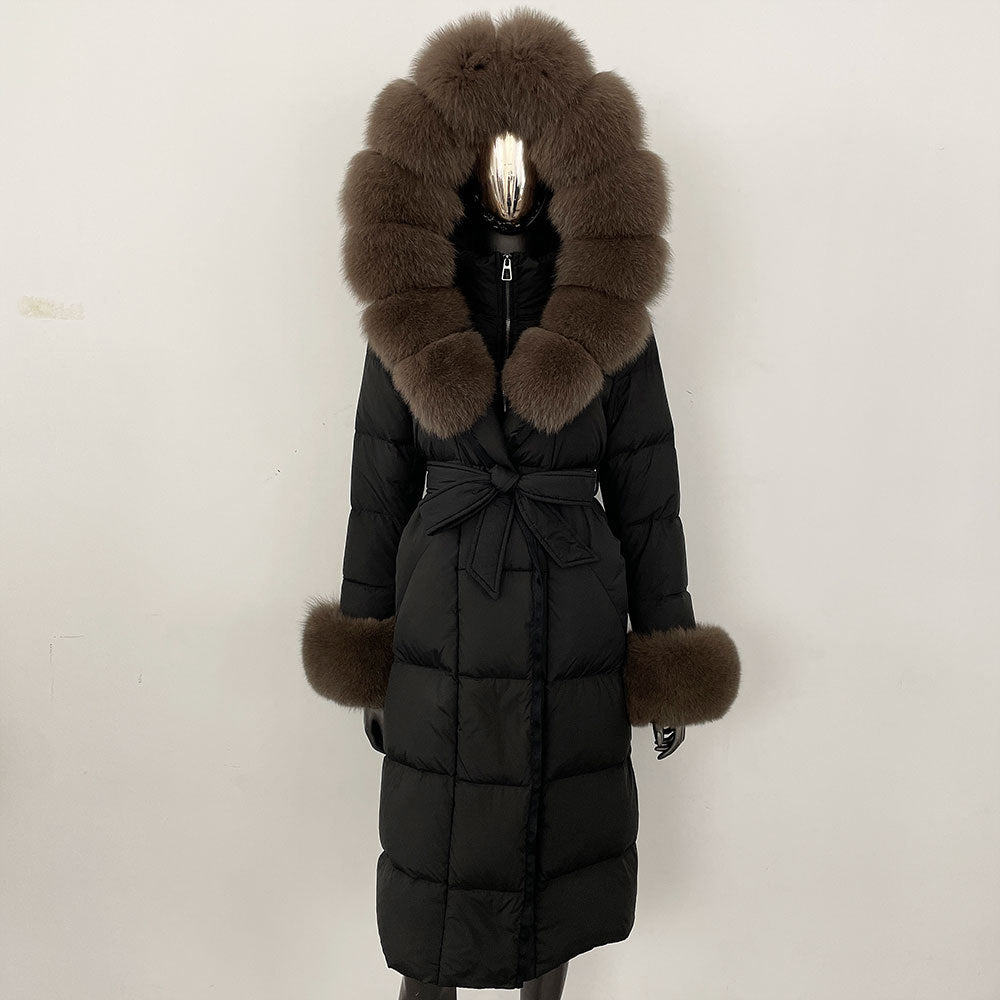 Black puffer coat with fur hood and cuffs on a mannequin against a white background