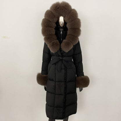 Black puffer coat with fur hood and cuffs on a mannequin against a white background