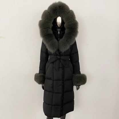 Black puffer coat with large fur hood and cuffs on a white background