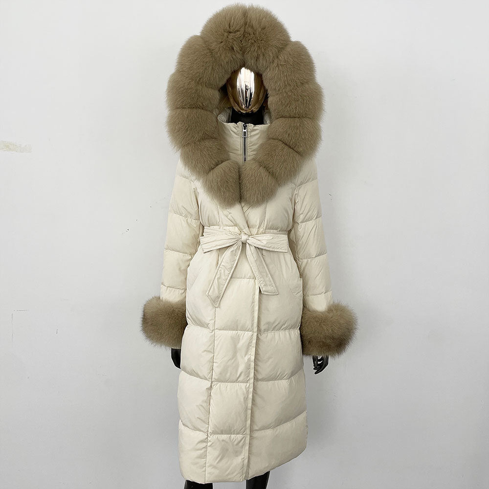 Beige puffer coat with fur hood and cuffs on a white background