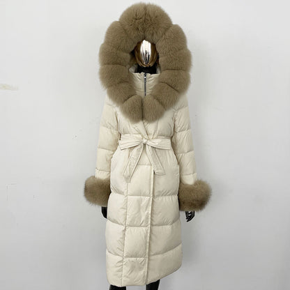 Beige puffer coat with fur hood and cuffs on a white background