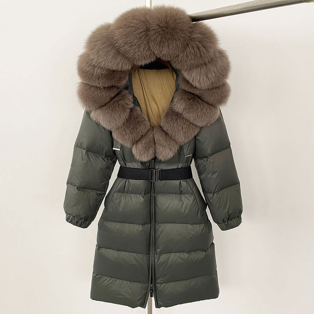 Green puffer coat with fur hood on a white background