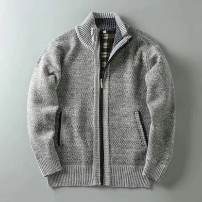 Gray zip-up sweater on a light gray background
