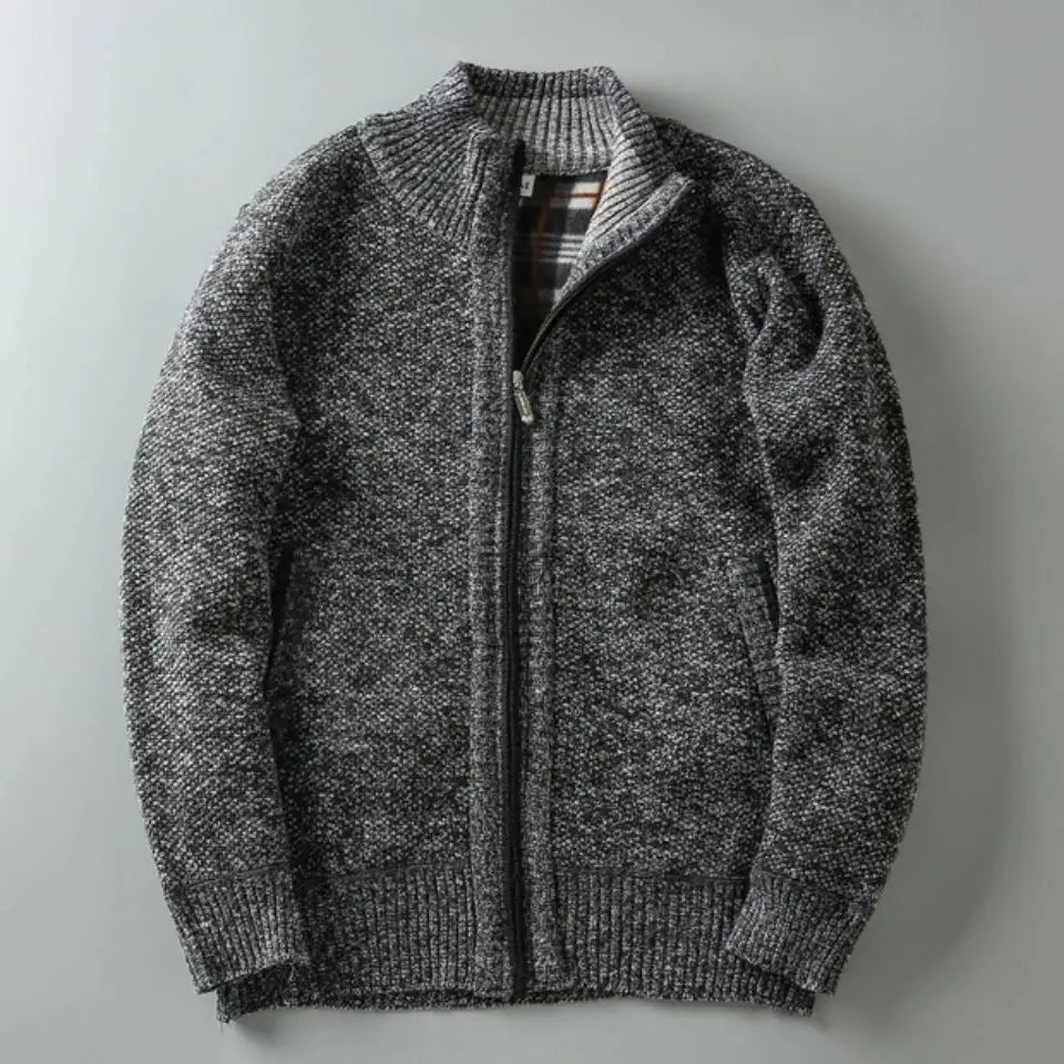 Gray knitted zip-up sweater on a light gray background