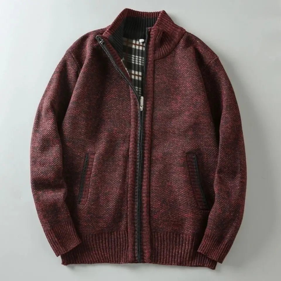 Maroon zip-up sweater on a light gray background