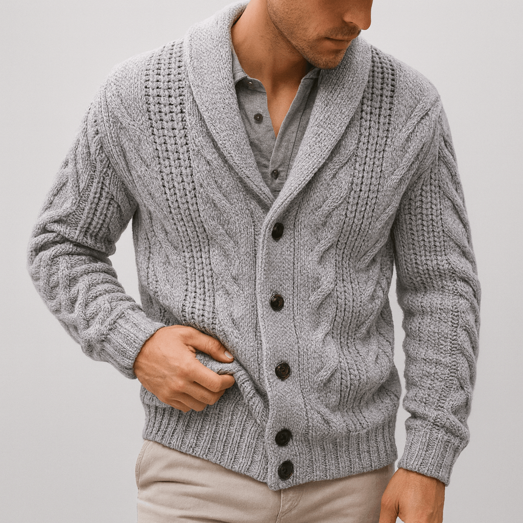 Man wearing a gray knitted cardigan with button details on a plain background