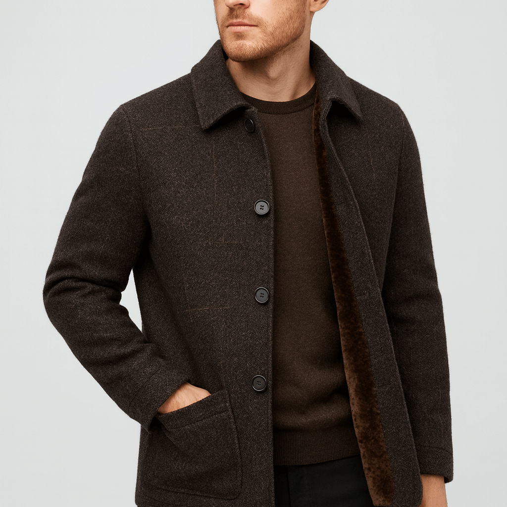 Man wearing a brown coat on a light gray background