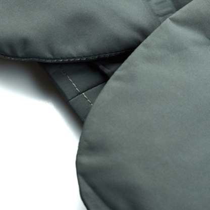 Close-up of a gray fabric surface with stitching details
