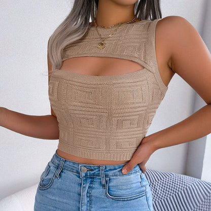 Beige knitted crop top worn by a person against a white background