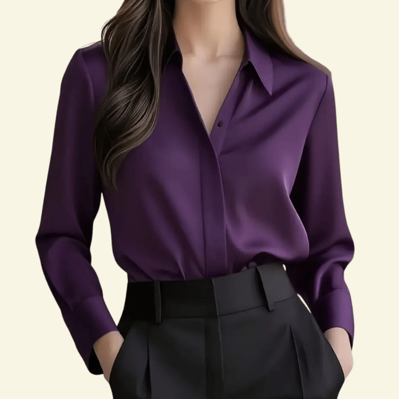 Purple shirt worn by a person on a beige background