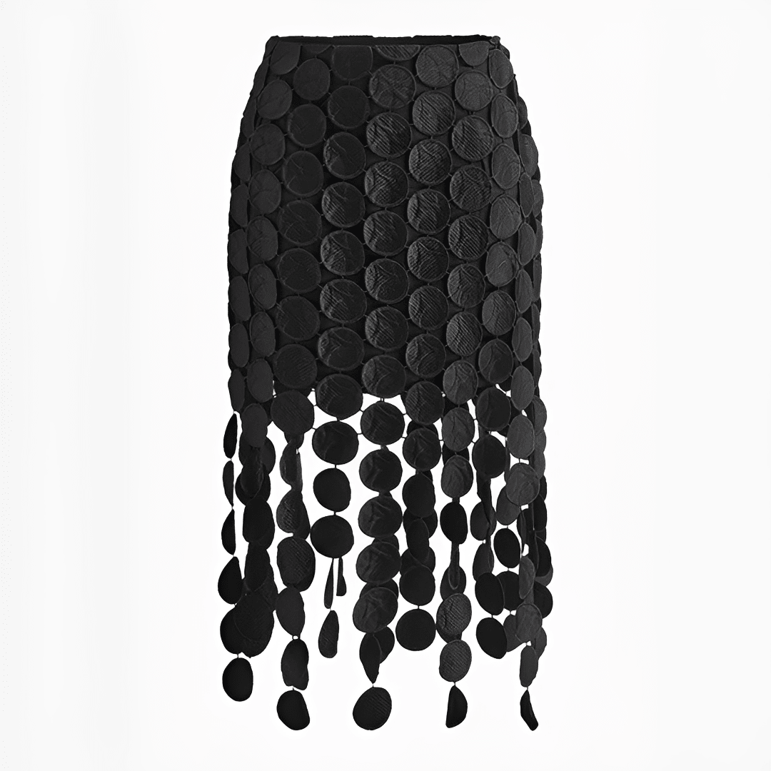 Black skirt with circular patterns and fringe on a white background