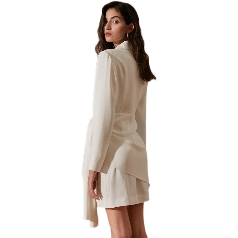 Woman wearing a beige dress on a white background