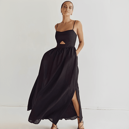 Woman wearing a black dress with cut-out design on a white background