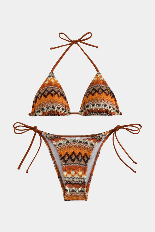 Orange and brown patterned bikini set on a white background
