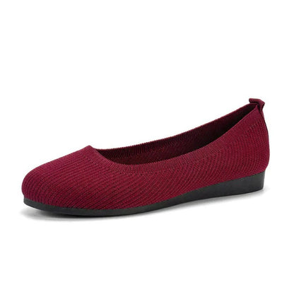 Red flat shoe on a white background