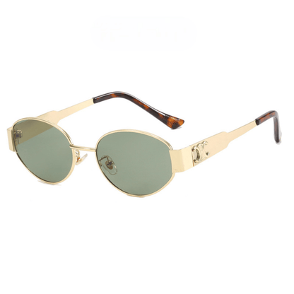 Gold-framed sunglasses with green lenses on a white background