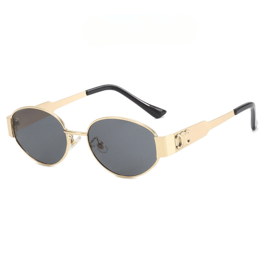 Gold-framed sunglasses with black lenses on a white background