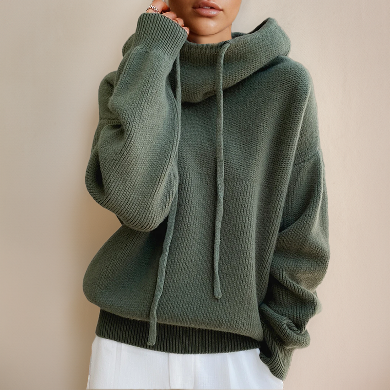 Person wearing a green turtleneck sweater