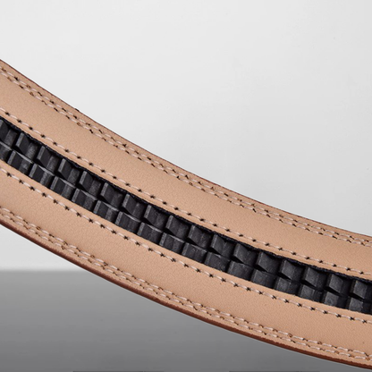 Close-up of a brown leather belt with black rubberized strip on a light gray background