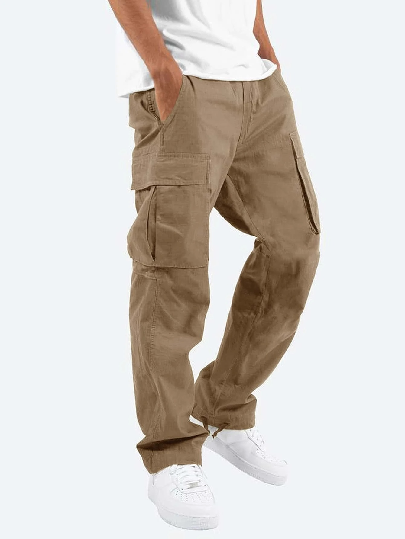 Beige cargo pants worn by a person on a white background
