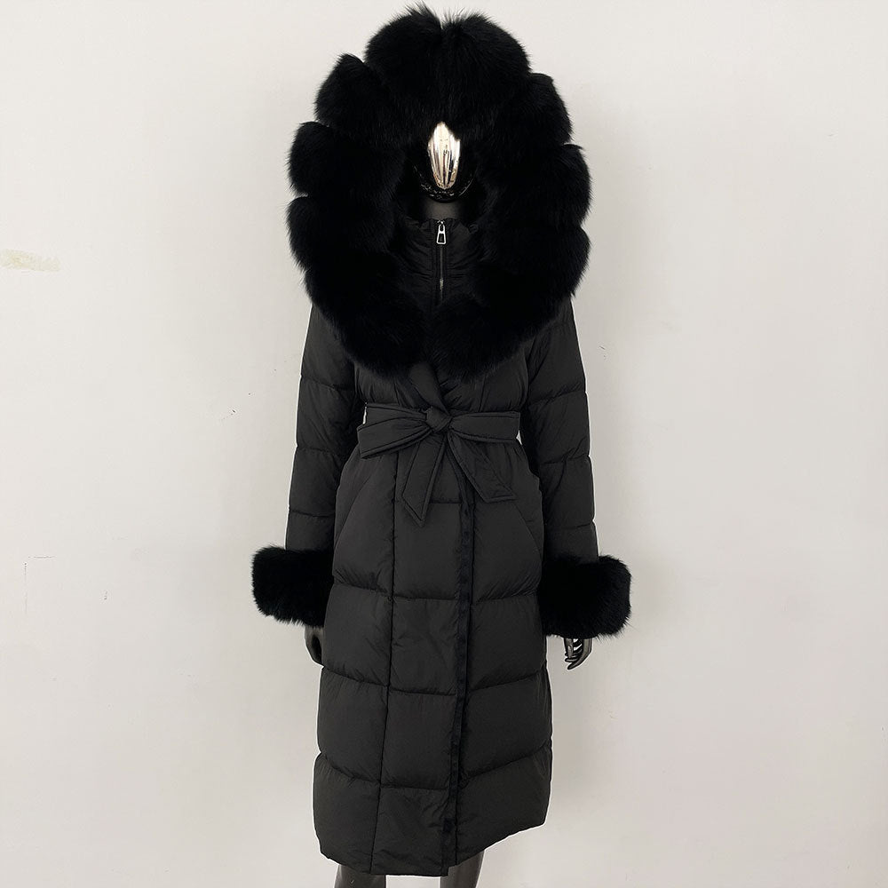 Black winter coat with fur hood and cuffs on a white background