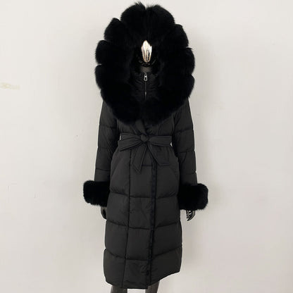 Black winter coat with fur hood and cuffs on a white background