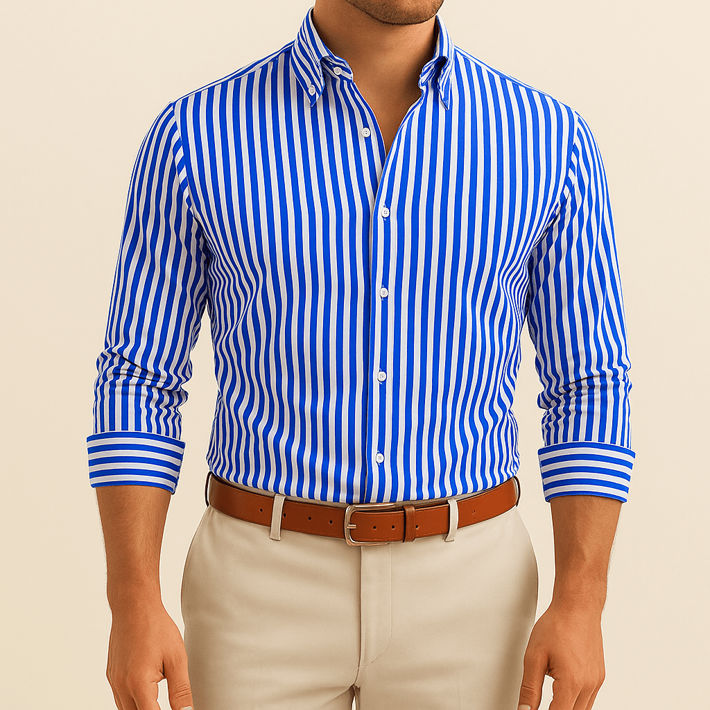 Man wearing a blue and white striped shirt with beige pants on a beige background