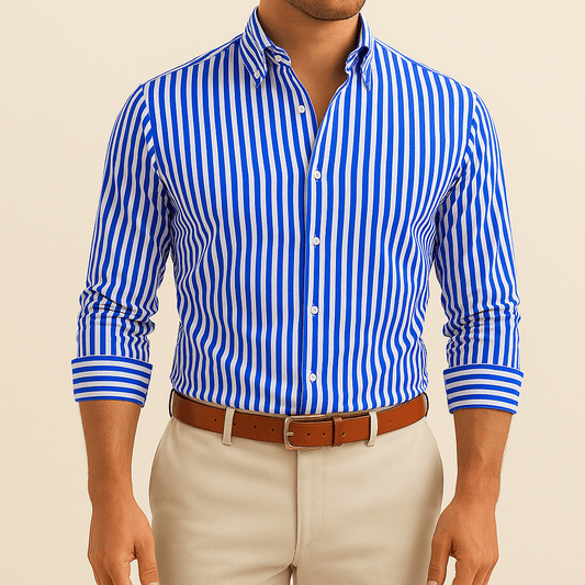 Man wearing a blue and white striped shirt with beige pants on a beige background