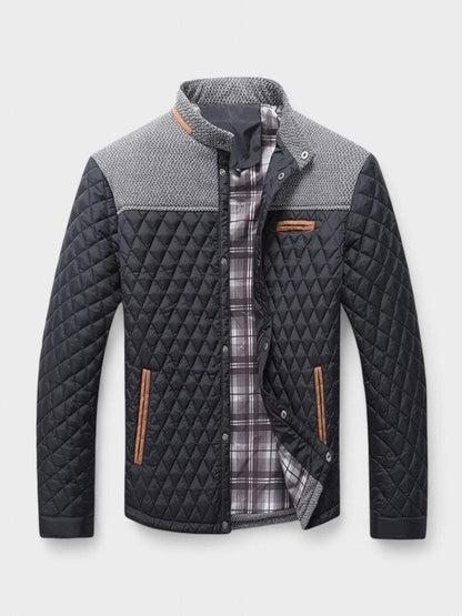 Quilted jacket with plaid lining on a light gray background