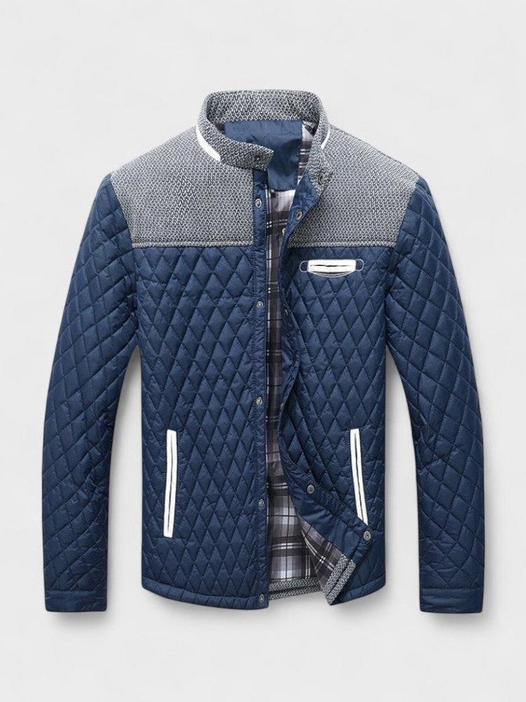 Blue quilted jacket with gray collar on a light gray background