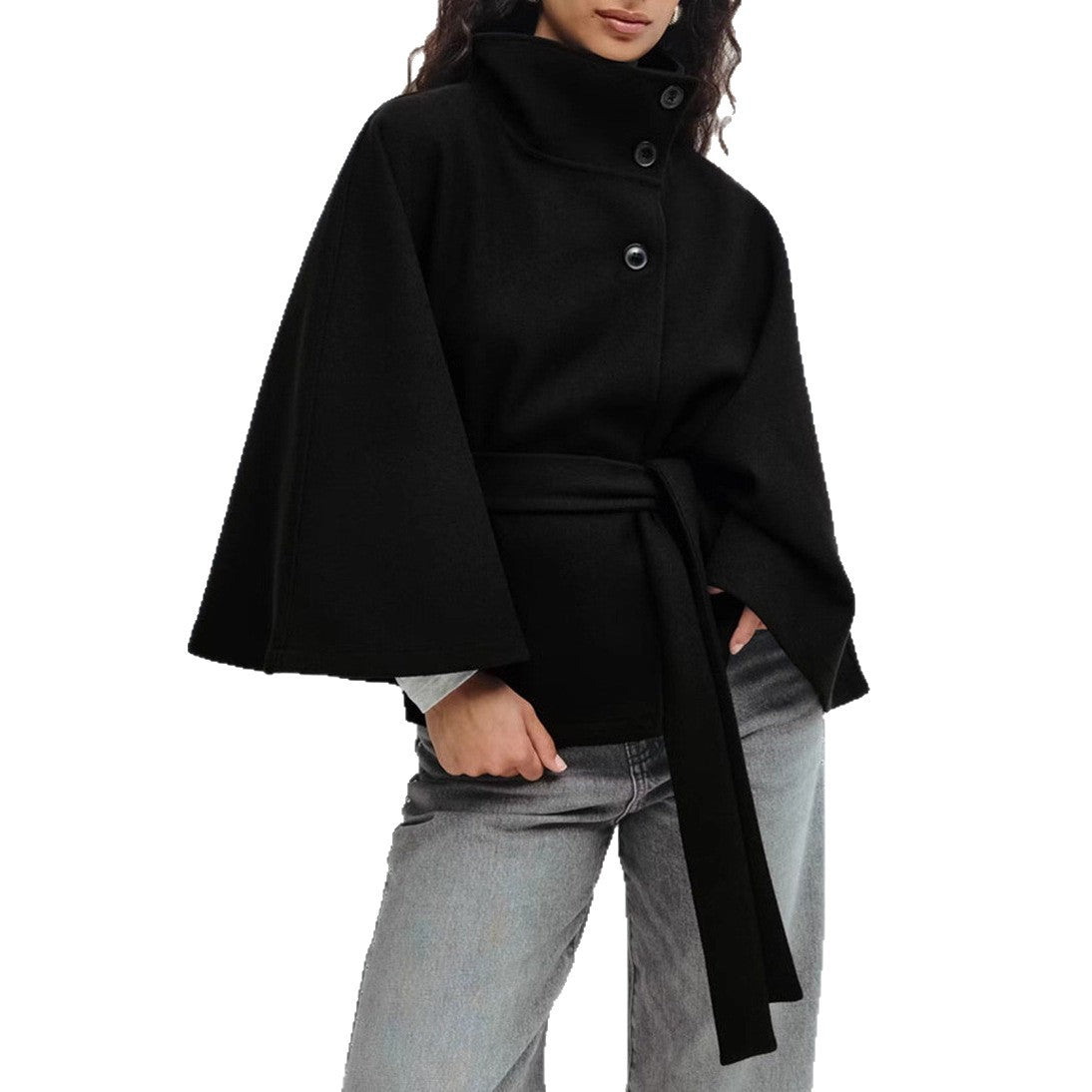 Black cape worn by a person on a white background