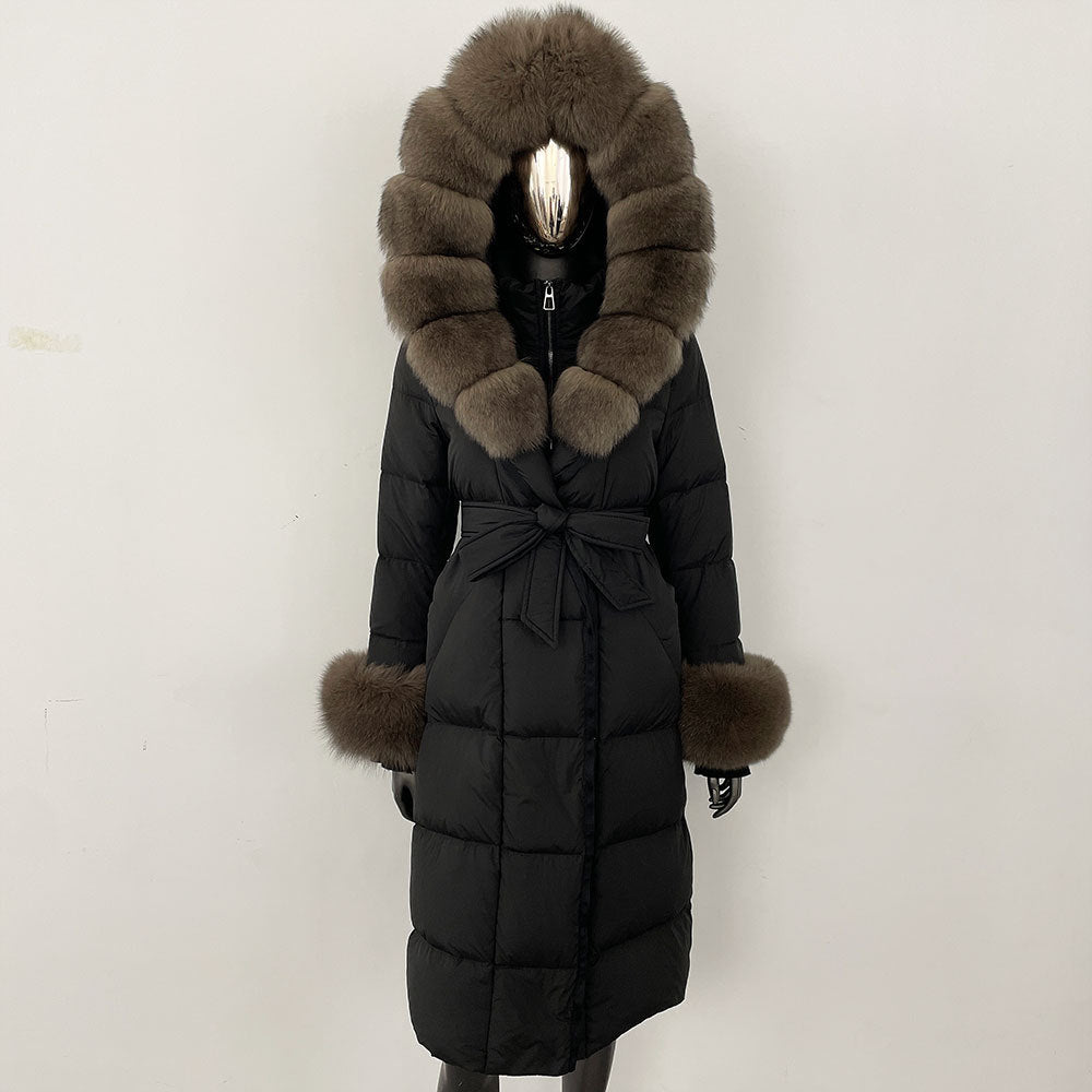 Black puffer coat with fur hood and cuffs on a white background