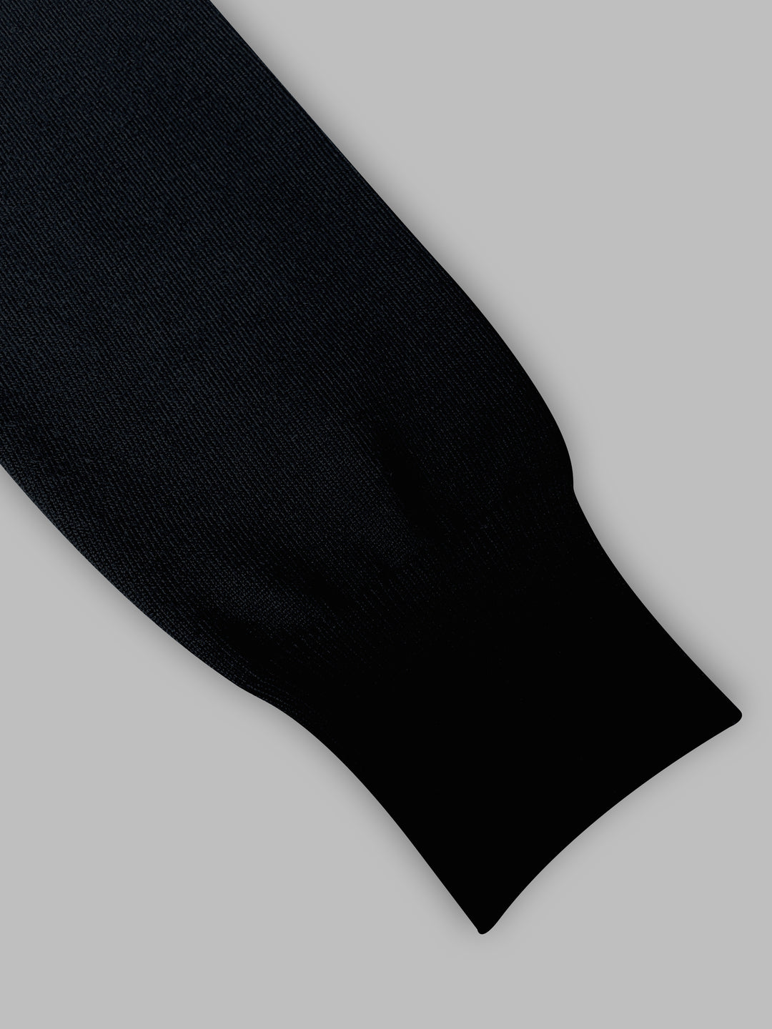 Black sock on a light gray background