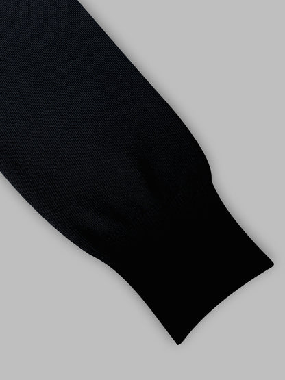 Black sock on a light gray background