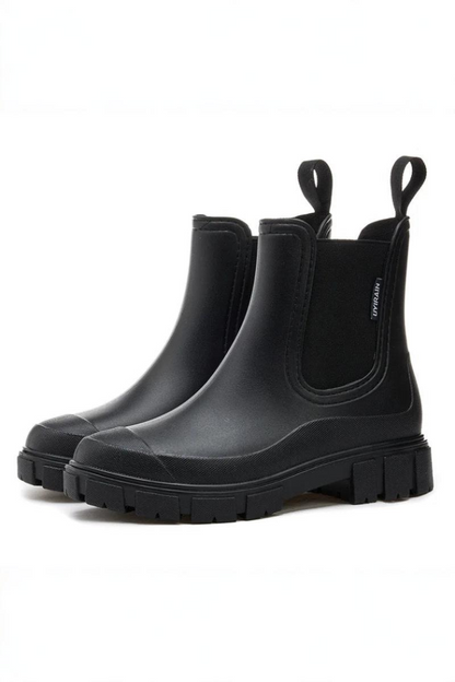 Pair of black rubber boots on a white background