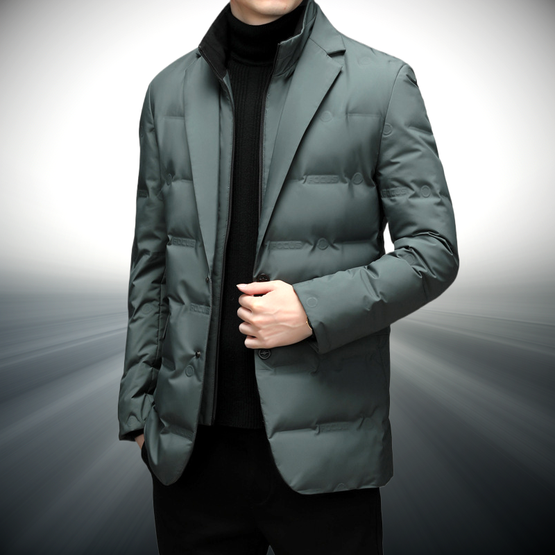 Person wearing a green puffer jacket on a gray background