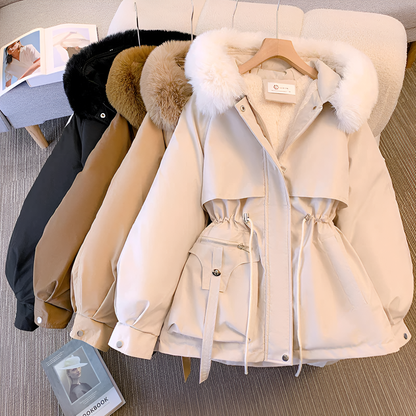 Beige parka with fur trim on a hanger against a neutral background