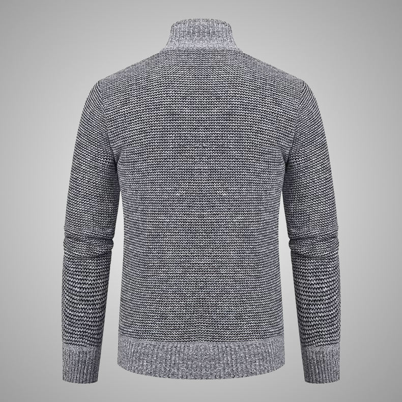 Gray knitted sweater on a gray background