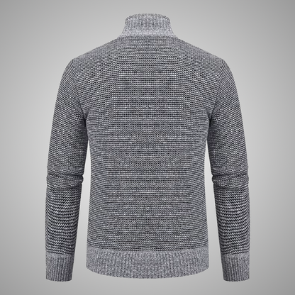 Gray knitted sweater on a gray background